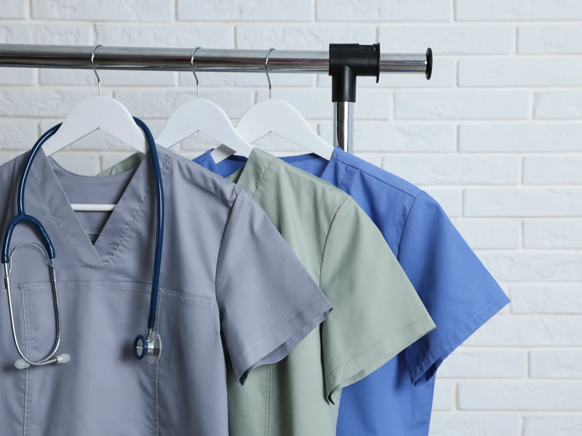 Healthcare uniforms on a clothing rail